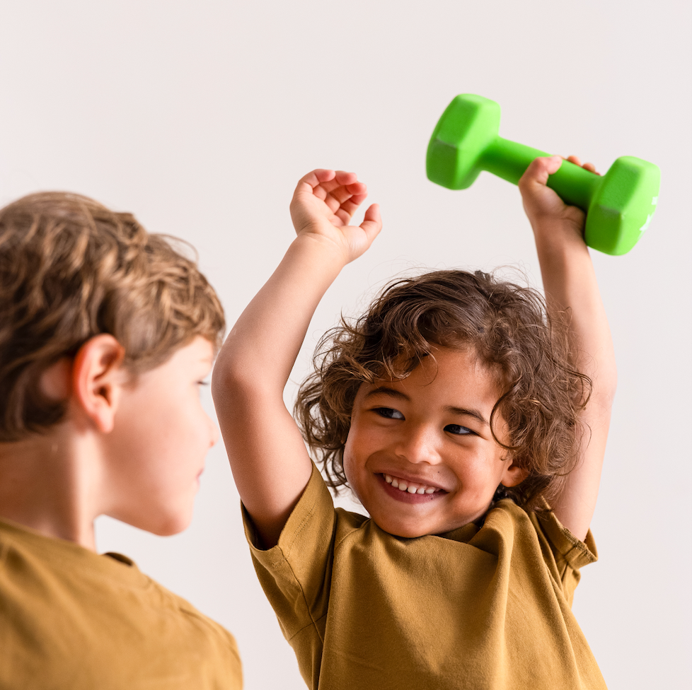 strong, happy, healthy kids playing with kids weights